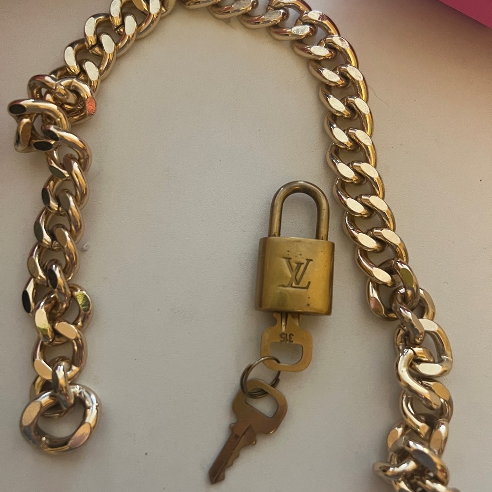 Louis Vuitton Vintage Lock and Key with chain

Chain is from All Saints!